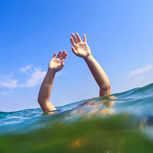 Drowning Man Raising Hands for Help