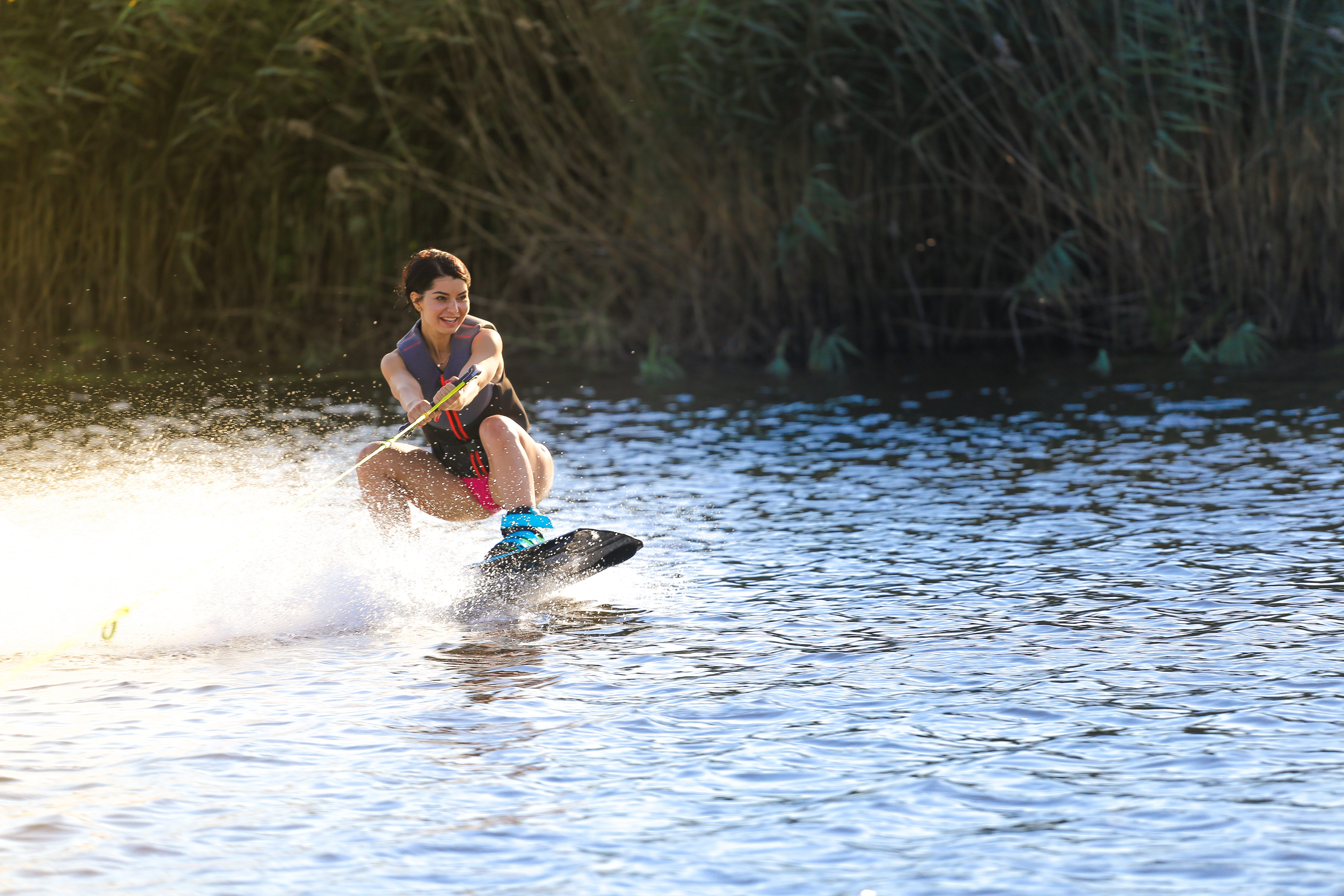 Happy Girl Riding on Wakeboard