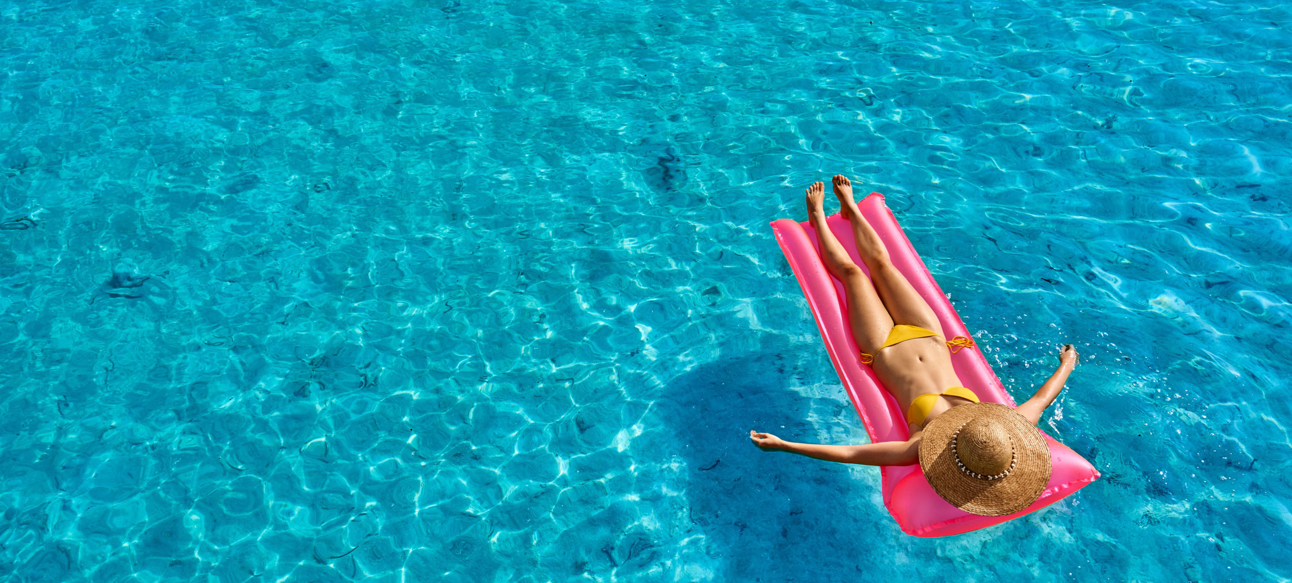 Woman Relaxing on Inflatable Mat Float