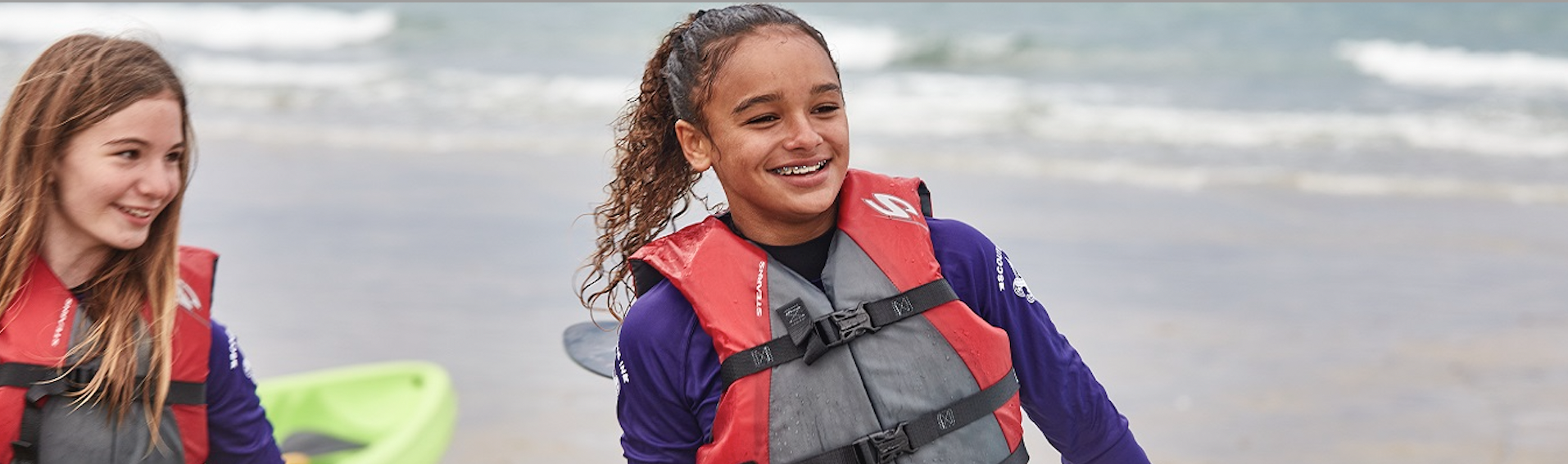 African Girl in Red and Grey Life Jacket