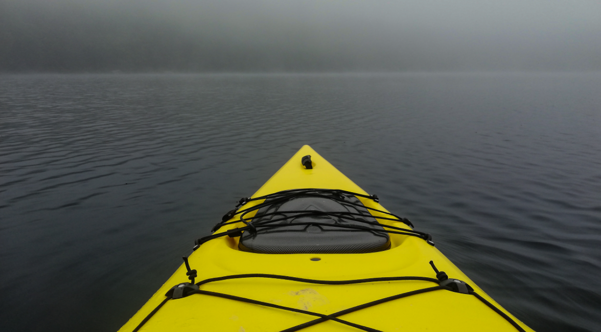Kayak in Foggy Ocean