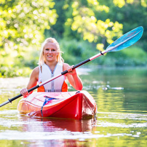 Woman Kayaking in Lake