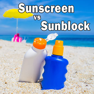Sunscreen vs Sunblock Tube Lying in Sand